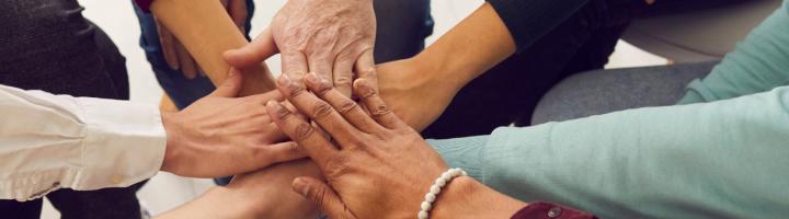 people-different-ages-nationalities-placing-hands-top-each-other.jpg